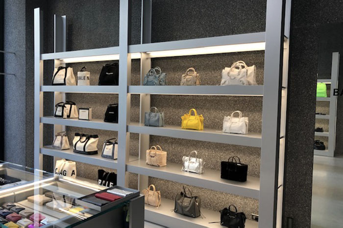 Wall of purses at Balenciaga boutique
