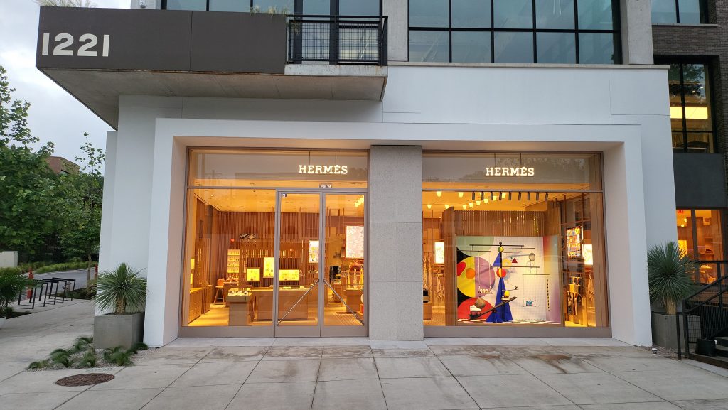 The Hermes storefront in Austin Texas Congress Avenue with lit windows